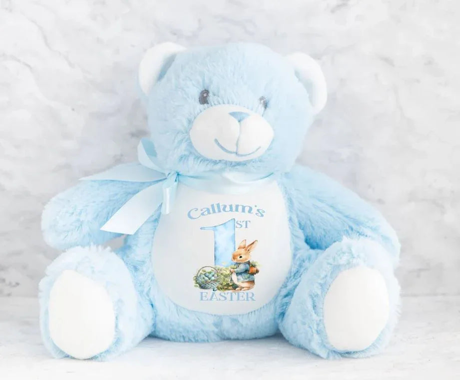 Osito azul de peluche, suave y simpático, con lazo y diseño personalizado en la panza.