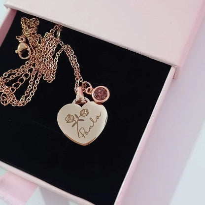 Collar personalizado de corazón dorado con nombre y rosa, ideal para regalo especial.